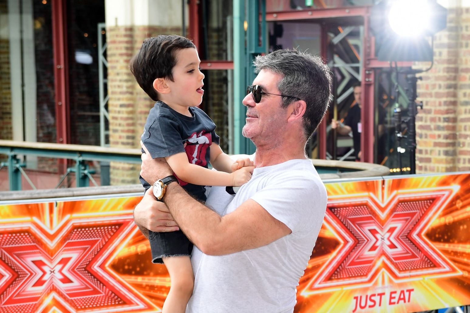Simon Cowell says he was ‘really unhappy’ and a workaholic before becoming a dad 